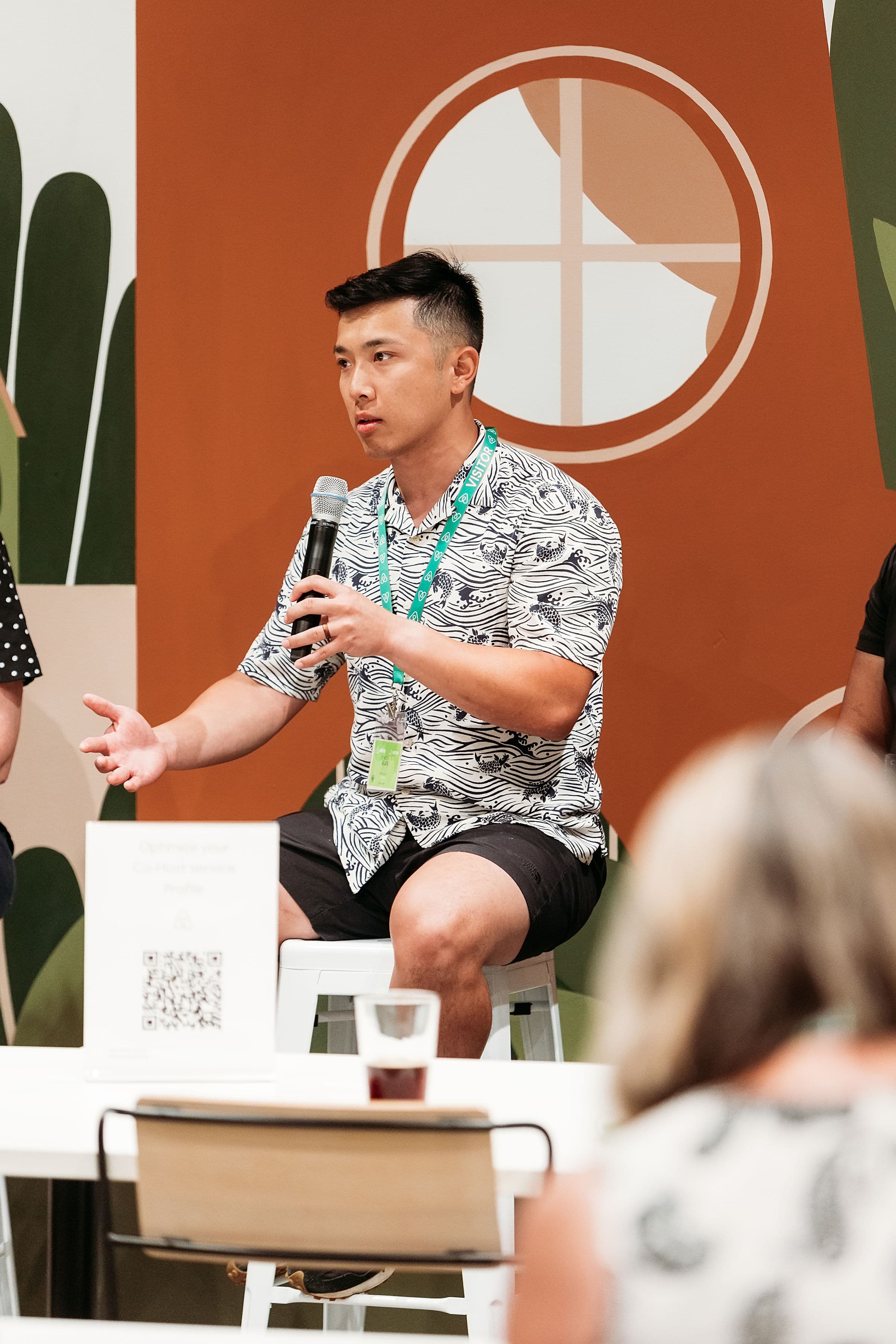 Alan presenting on stage at Airbnb's first Co-Host Summit